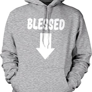 May include: A gray hooded sweatshirt with the word "BLESSED" printed in white on the front. A white arrow pointing down is below the word.