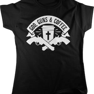 May include: Black t-shirt with a white graphic design featuring a coffee cup with a cross, two crossed pistols, and the text "God, Guns & Coffee".
