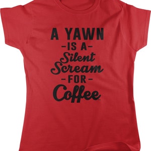 May include: A red t-shirt with the text "A YAWN -IS A- Silent Scream -FOR- Coffee" in black lettering. The shirt has a crew neck and short sleeves. The text is in a mix of fonts.