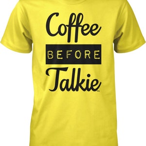 May include: Yellow t-shirt with black text that reads "Coffee Before Talkie".