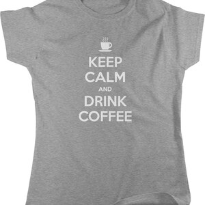 May include: Gray t-shirt with white text that reads "Keep Calm and Drink Coffee" with a coffee cup icon above the text.
