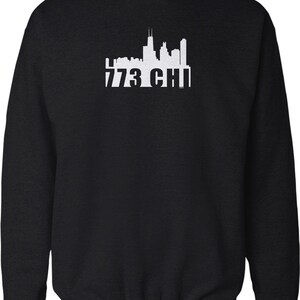 May include: Black sweatshirt with a white silhouette of the Chicago skyline and the text "773 CHI" printed on the front.