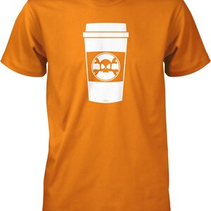 May include: Orange t-shirt with a white graphic of a coffee cup with a skull and crossbones design.