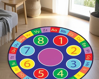 May include: A colorful round play mat with a blue background and a circle in the center. The circle is surrounded by eight smaller circles, each with a different number and letter. The numbers are 1 through 8, and the letters are A through H.