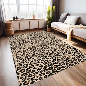 May include: A beige and brown area rug with a leopard print pattern. The rug is made of soft, plush material and is perfect for adding a touch of style to any room.