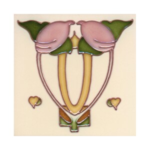 May include: A ceramic tile with a pink and green floral design. The design features two stylized flowers with heart-shaped leaves. The tile has a cream-colored background.