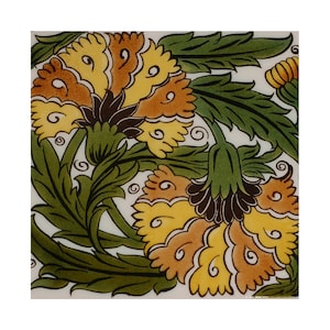 May include: Square tile with a floral design. The tile features yellow and brown flowers with green leaves and stems against a white background. The flowers have a detailed, layered appearance.
