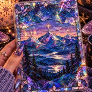 May include: A rectangular decorative panel featuring a stained glass style illustration of snow-capped mountains, a winding river, and pine trees under a starry sky. The artwork displays vibrant shades of blue, purple, and pink with a holographic finish.