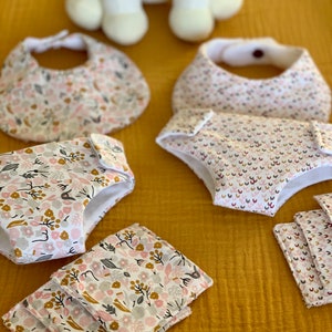 Baby doll kit with diaper, wipes and bib