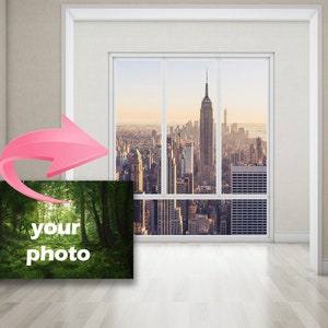 May include: A photo mockup showing a blank canvas with the text "your photo" in a room with a window view of a city skyline. The window is framed in white and the room has white walls and light wood floors.