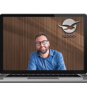 May include: A man with a beard and glasses smiles at the camera while on a video call. The background is a wood panel wall with a logo of a bird in a circle with the word "LOGO" below it.