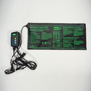 May include: A black and green seedling heat mat with a digital thermostat. The mat is labeled "Seedling Heat Mat" and "Jump Start". The thermostat has a digital display showing "1888".