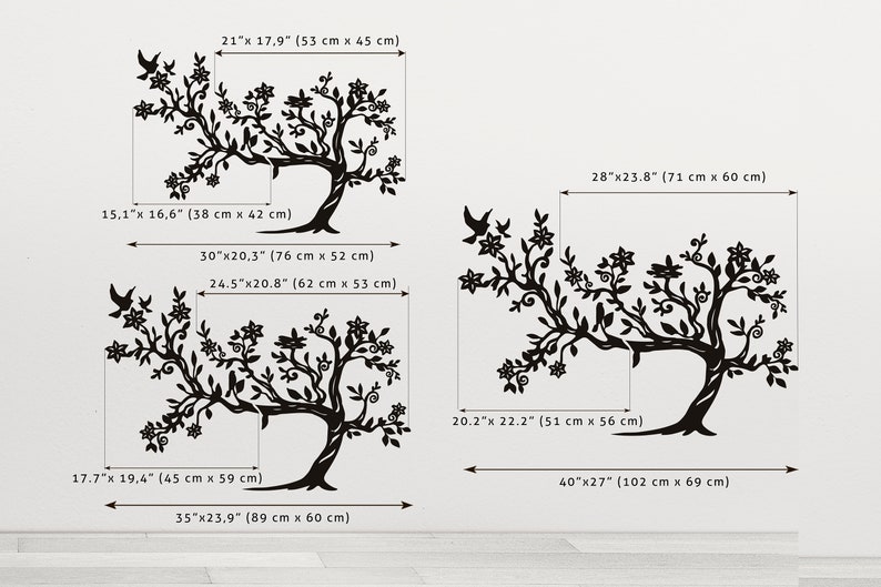 May include: A set of three black and white wall decals featuring stylized tree silhouettes with intricate branches and flowers. The decals are available in various sizes, with measurements in inches and centimeters.