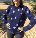 Hand knitted Coraline inspired stars sweater product logo