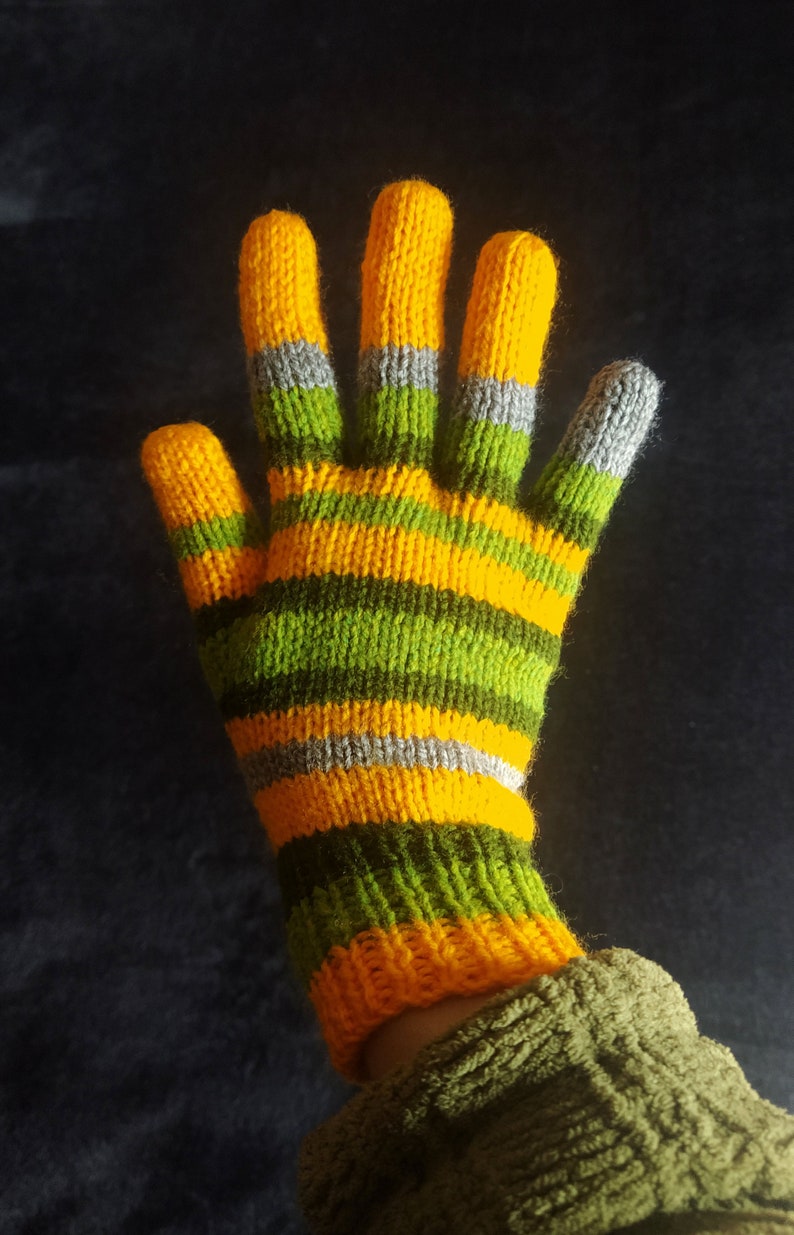 May include: Yellow and green striped knitted gloves with gray accents.