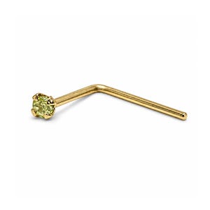 May include: An L-shaped nose stud crafted from yellow gold, featuring a small, round, light green gemstone held in place by a four-prong setting. The metal post is smooth and polished, extending from the base of the gemstone setting at a right angle.