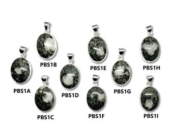 May include: Ten silver pendants with green and white stone inlays. The pendants are oval shaped and have a silver bail. The pendants are labelled with the letters A through I and the letter L.