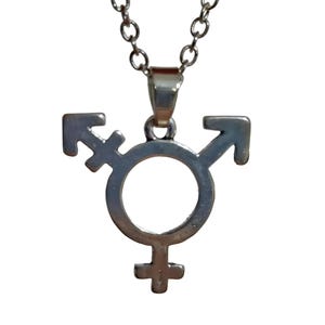 May include: Silver necklace with a pendant featuring the transgender symbol. The symbol is a circle with a cross at the bottom and an arrow pointing to the right on top of the circle. Another arrow pointing to the left is attached to the circle.