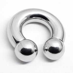 May include: A shiny, silver-colored horseshoe-shaped body jewelry piece. The jewelry has a curved bar with a smooth, rounded surface and two spherical ends. The piece is designed to be worn as a piercing.