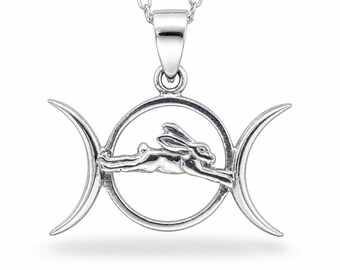 May include: A silver-toned pendant necklace featuring a central circular frame containing a leaping rabbit figure, flanked by two crescent moon shapes on either side. The pendant is suspended from a delicate silver-toned chain link necklace.