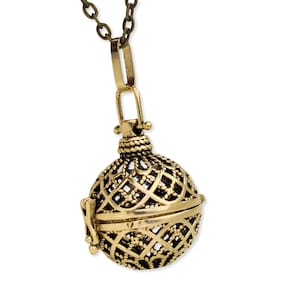 May include: A gold-toned metal cage pendant necklace with a delicate, intricate design. The cage is open on one side and has a small loop at the top for attaching to a chain.