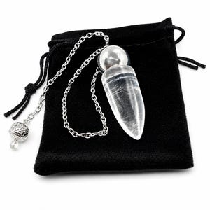 May include: A clear, pointed crystal pendulum with a silver-toned metal cap attached to a silver-colored chain. The chain features a small, textured, spherical silver-toned bead at the end. The item is displayed against a black velvet pouch.