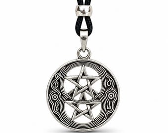 May include: A silver pendant necklace with a double pentagram design within a circular frame. The pendant hangs from a black cord with a silver clasp. The intricate design includes decorative swirls and floral elements.