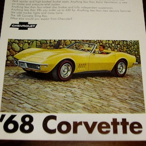 May include: A yellow 1968 Chevrolet Corvette Sting Ray convertible sports car with a black interior. The car is parked on a cobblestone street. The text 'Did you expect anything less from The Leader?' and '68 Corvette' is visible in the image.