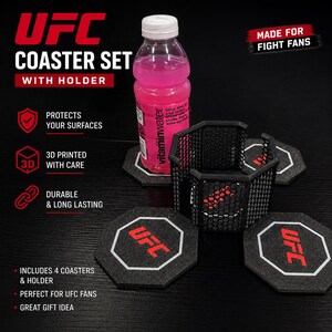 May include: A black UFC coaster set with a holder. The set includes four coasters with the UFC logo in red and white. The holder is a black cage design. A bottle of pink vitaminwater sits on one of the coasters.
