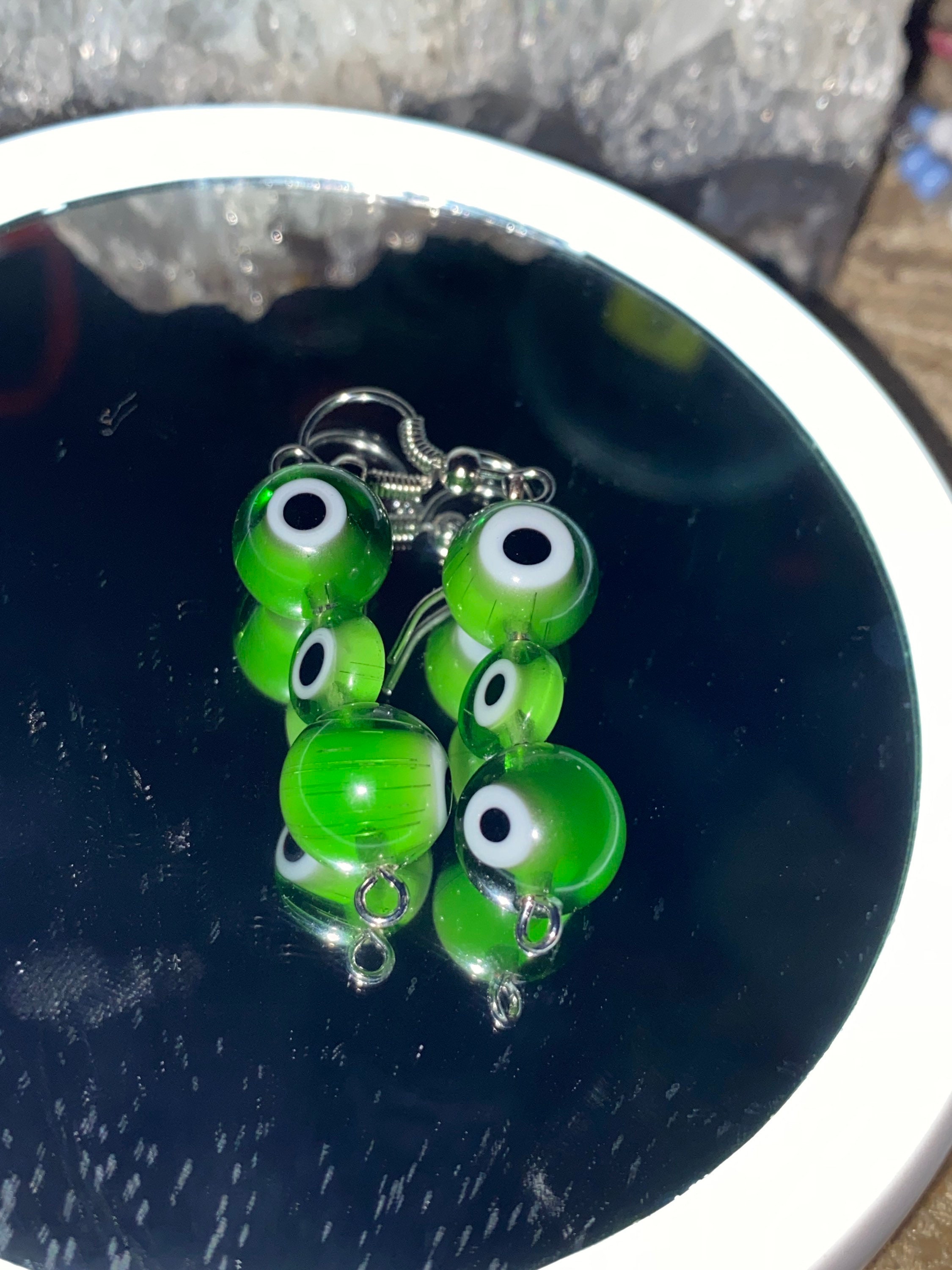 Light green evil eye earrings Etsy