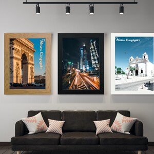 May include: Three framed photographs of cityscapes. The leftmost photo shows the Arc de Triomphe in Paris, France. The middle photo shows a cityscape at night with a tall building and a train track in the foreground. The rightmost photo shows a white church building with a blue sky in the background.