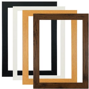May include: Four picture frames in different colours: black, white, light brown, and dark brown. The frames are all the same size and shape, and they are all made of wood.