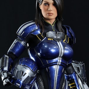 May include: A female action figure wearing a blue and silver spacesuit with a black and yellow design. The figure has long dark hair and is holding a helmet in her left hand.