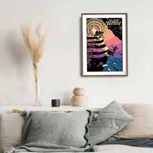 May include: A framed poster with a colorful illustration of a couple walking up a staircase. The poster is titled "The Lovers Orpheus & Eurydice".
