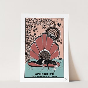 May include: A black and white illustration of the Greek goddess Aphrodite, lying on a seashell. The illustration is surrounded by a pink background with black floral designs. The text "APHRODITE THE GODDESS OF LOVE" is at the bottom of the image.