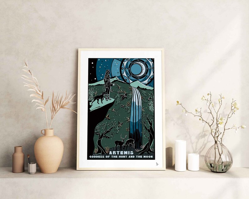 May include: A framed print of a goddess with a bow and arrow, standing in a forest with a waterfall. The print is titled "Artemis, Goddess of the Hunt and the Moon".