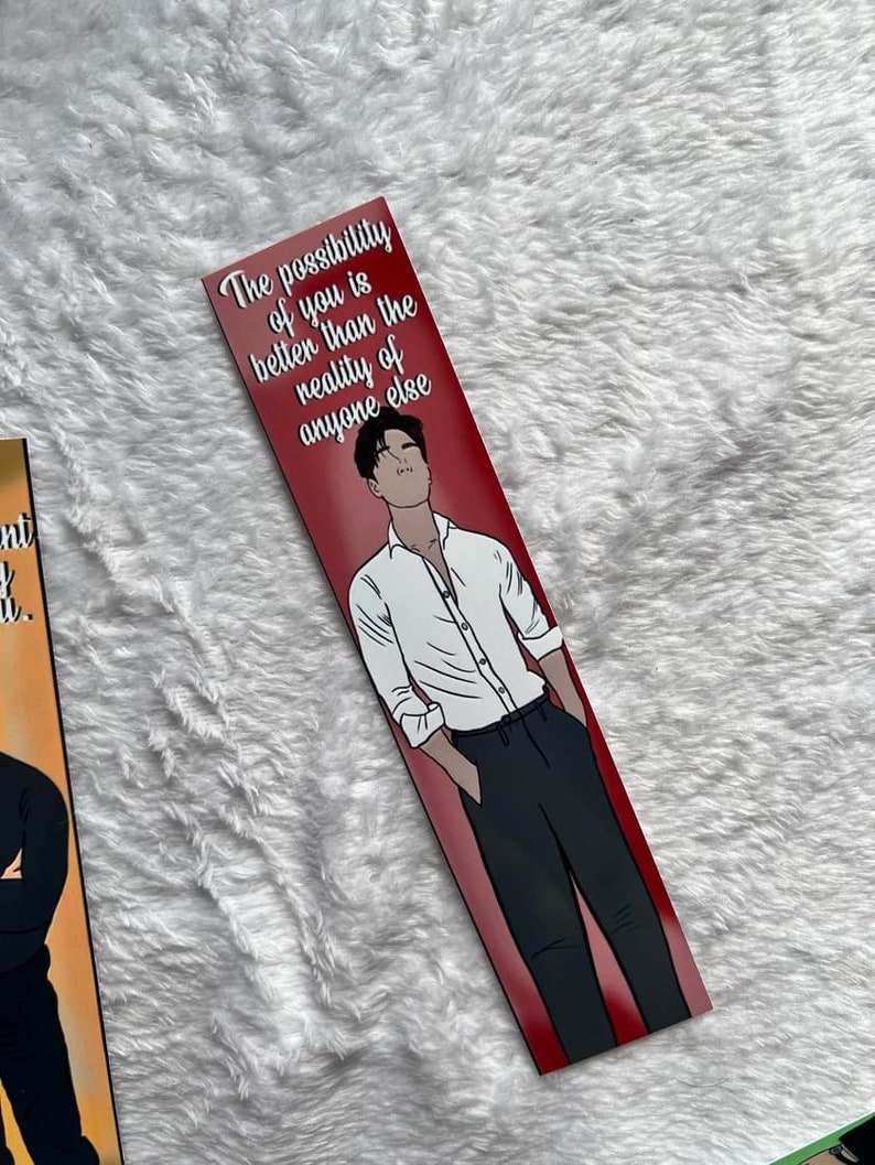 May include: A bookmark with a red background. It features an illustration of a person in a white shirt and black trousers. The text "The possibility of you is better than the reality of anyone else" is printed at the top.