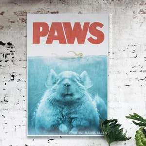 May include: A poster with the word "PAWS" in red text, with a blue background and a chinchilla submerged in the water. The poster is titled "PAWS" and has the artist's name, Mariel Allen, at the bottom.