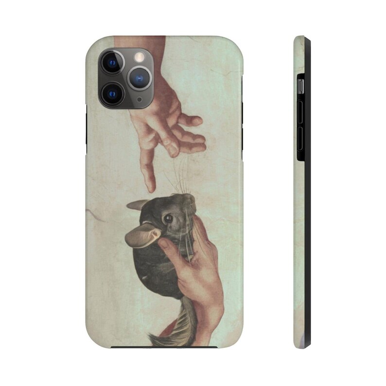 May include: A phone case with a design inspired by Michelangelo's "The Creation of Adam", but with a chinchilla replacing Adam. The image shows two hands reaching out, with the chinchilla in the centre. The background is a light beige colour.