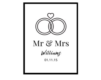 May include: Black and white illustration of two interlocked rings with a small heart above them. The text "Mr & Mrs Williams 01.11.15" is below the rings.