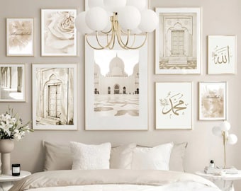 May include: A beige bedroom with a white bed and a white headboard. The wall is decorated with a collection of framed prints featuring Islamic calligraphy and architectural details in shades of beige and gold.