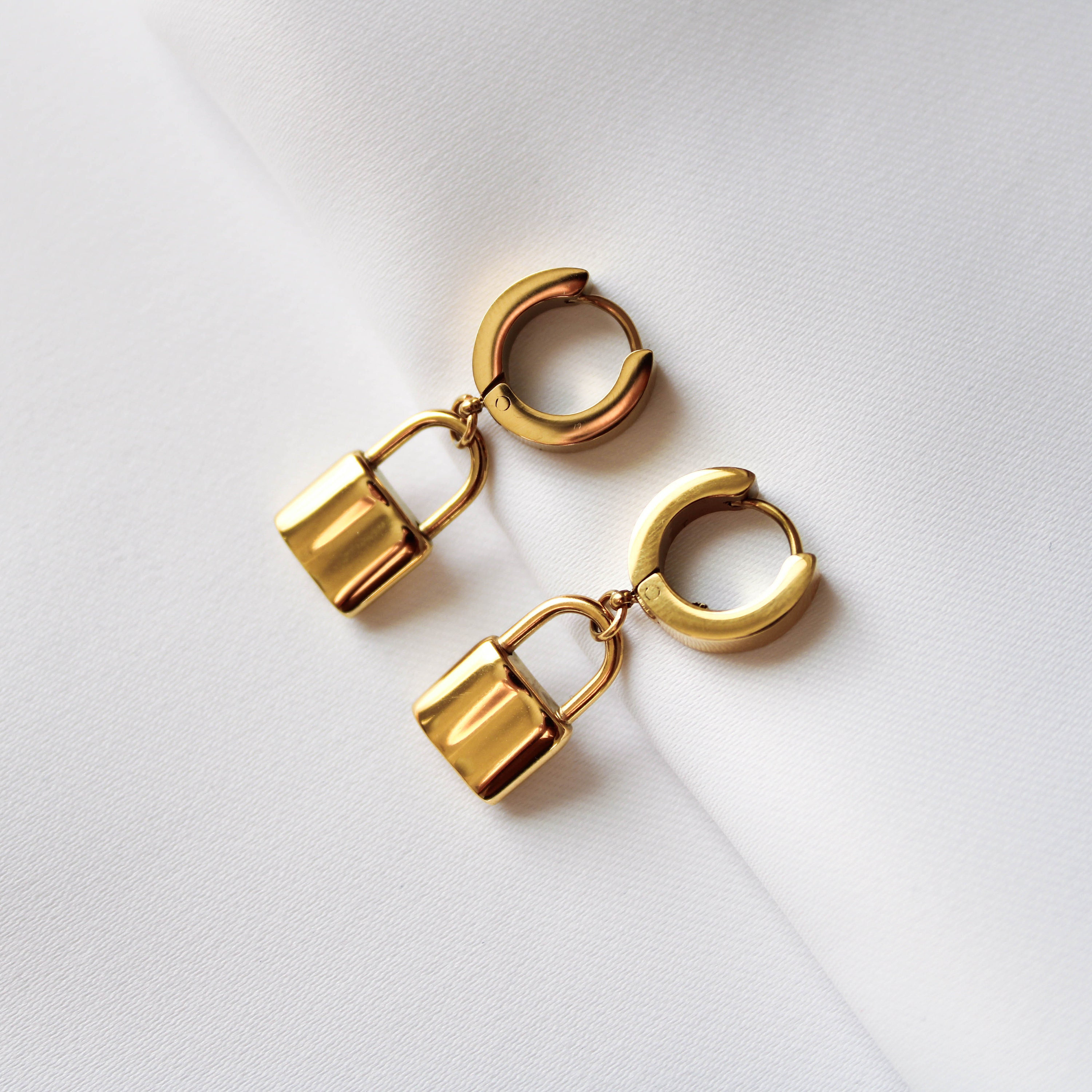 Tiffany Lock Earrings in Yellow Gold, Medium | Tiffany & Co.