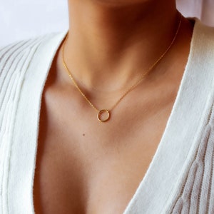 Featuring simple & minimalist yellow gold plated circle pendant on dainty rolo chain.