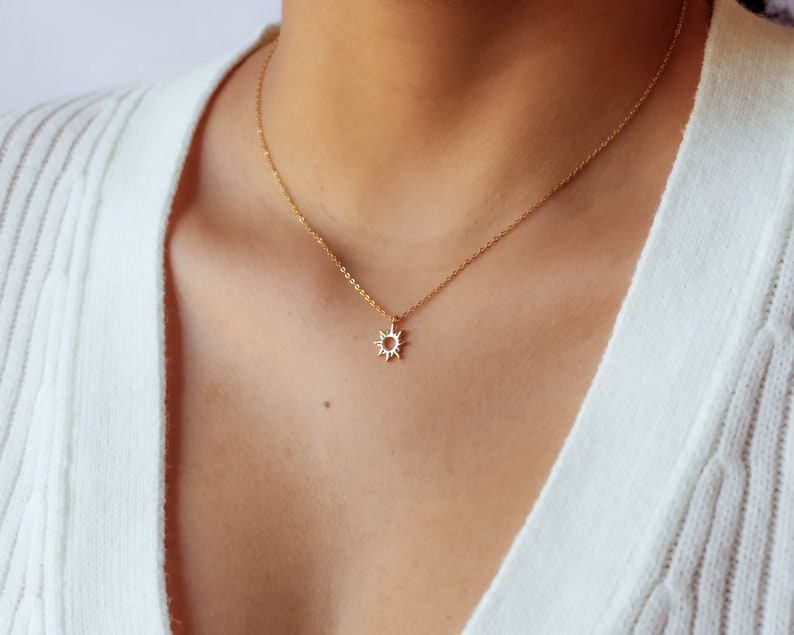 Featuring yellow gold plated minimalist sun pendant on delicate sterling silver rolo chain.