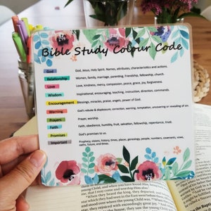 May include: A colourful chart with a floral design, titled "Bible Study Colour Code". The chart lists different categories of Bible study topics, such as God, Relationship, Love, Wisdom, Encouragement, Warning, Prayers, Faith, Promises, and Important, with a corresponding colour for each category.