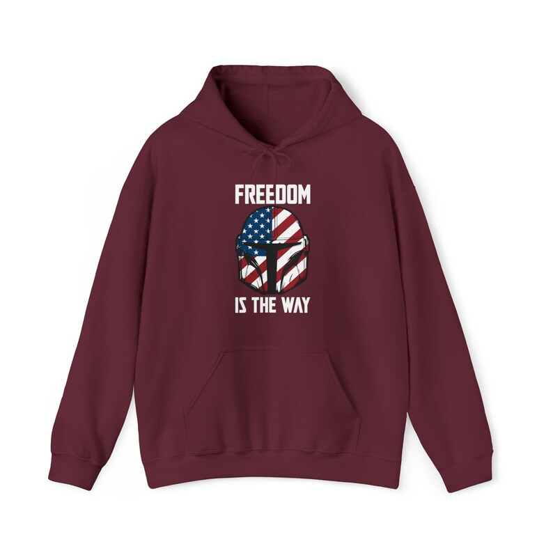 May include: Burgundy hoodie with a front graphic featuring a helmet design incorporating the American flag and the text "FREEDOM IS THE WAY" in white. The hoodie has a drawstring hood and a front pocket.