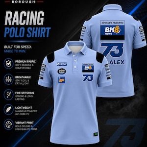 May include: A light blue polo shirt featuring black shoulder accents, a three-button placket, and various sponsor logos including BK8, Estrella Galicia, and the number 73. The shirt is displayed from both front and back angles with printed text.