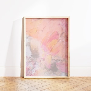 Puede incluir: Una pintura abstracta enmarcada con colores rosa, naranja y gris. La pintura tiene un aspecto texturizado, similar a la acuarela.