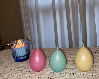 Set of three “egg” candles (yellow, pink, blue)