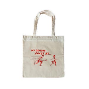 Chasing Demons Tote Bag
